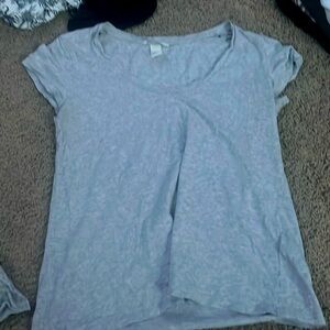 Gray swoop neck short sleeve shirt.